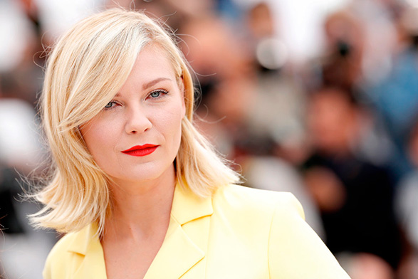 Kirsten-Dunst-went-retro-glam-sideswept-bang-paired